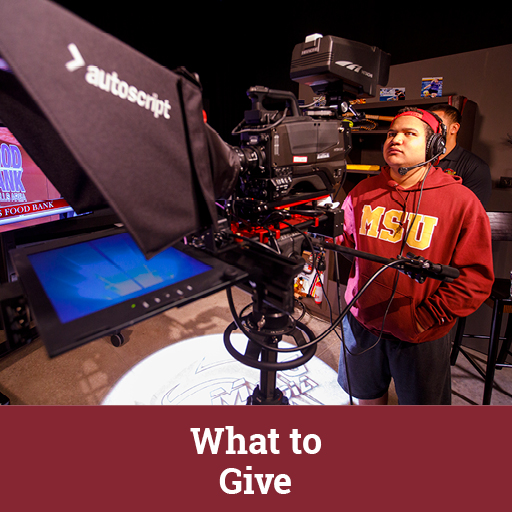 Photo of a student operating a camera. Links to What to Give